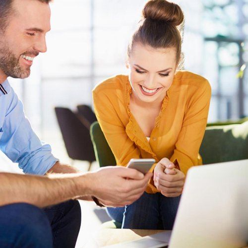 Two people reading reviews